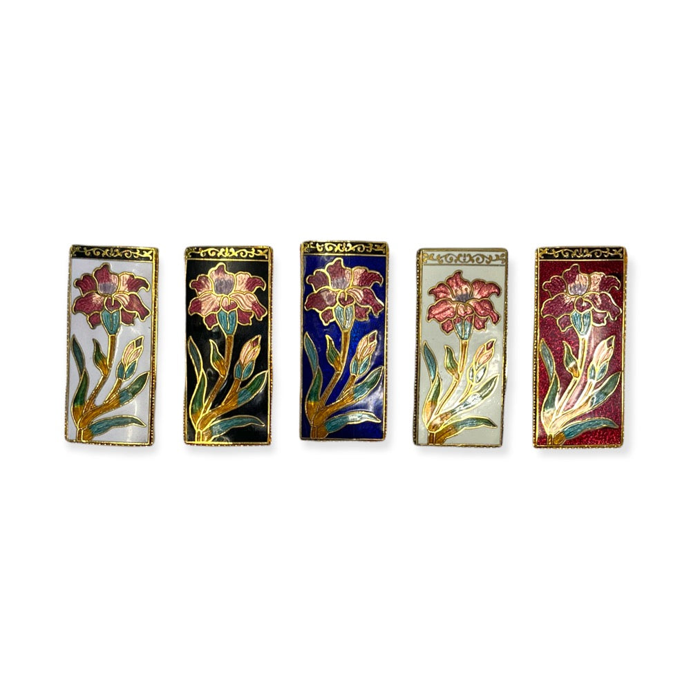 Cloisonne colored money clips in the following order from left to right. White, Black, Blue, Natural, Burgundy.