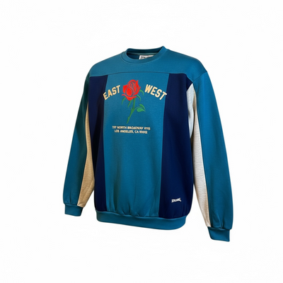 Blue and navy sweatshirt with a red rose graphic and text on a white background