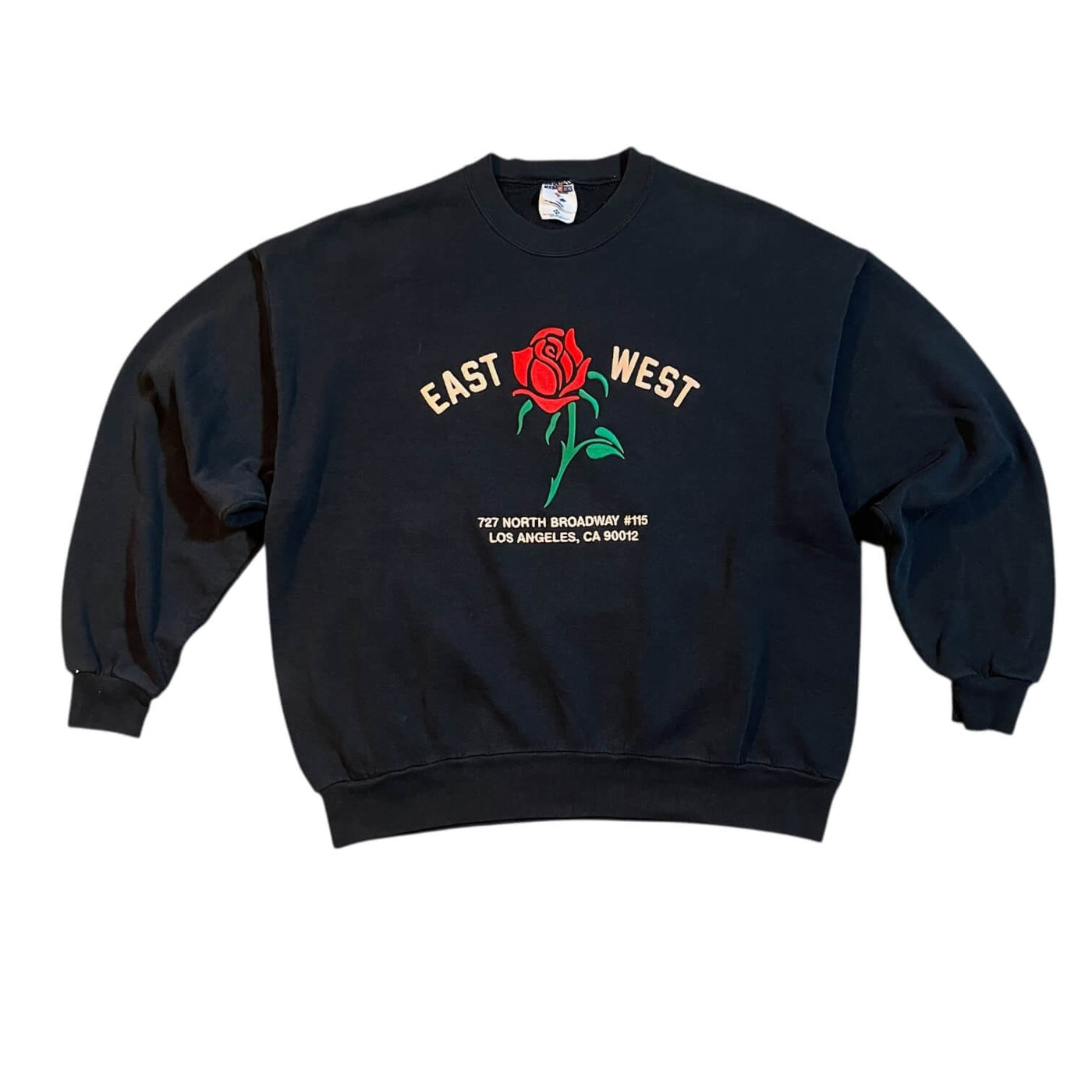 Black sweatshirt with a red rose graphic and text on a white background