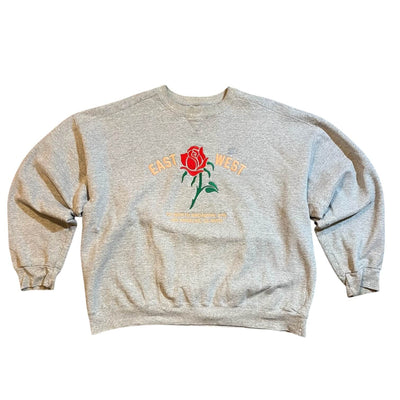 Gray sweatshirt with a rose graphic and text on a white background