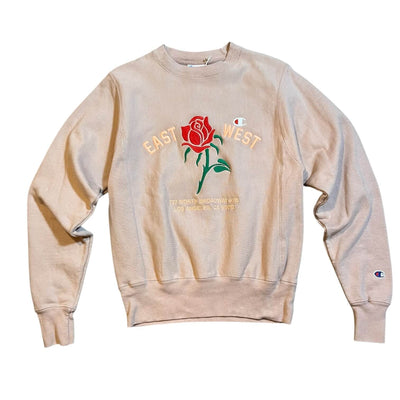 Pale lavender sweatshirt with a rose graphic and text on a white background