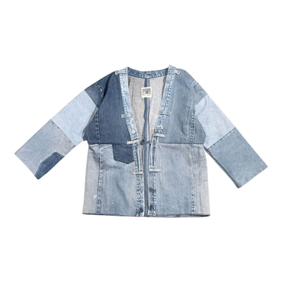 Patchwork denim jacket on a white background
