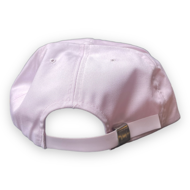 Pale pink hat back view shows plastic adjustable slider