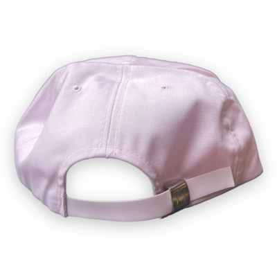 Pale pink hat back view shows plastic adjustable slider