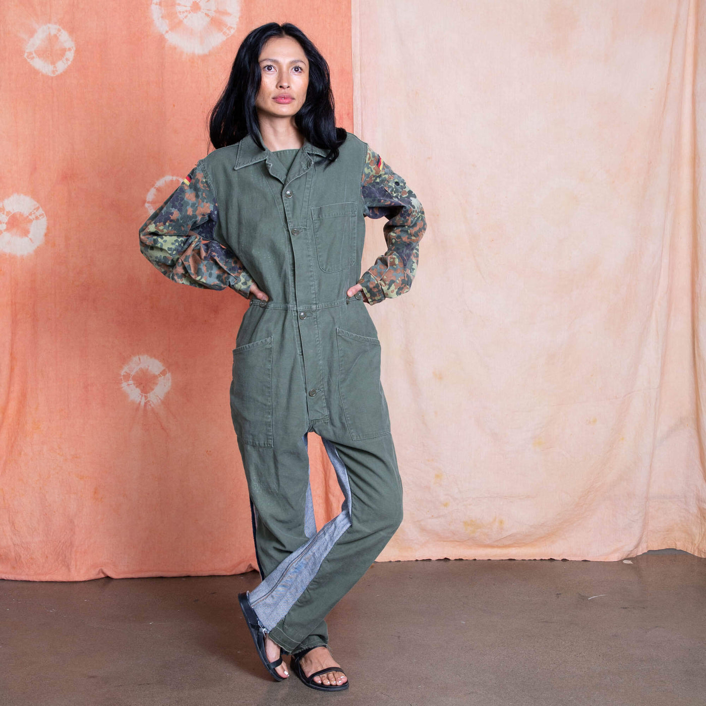 Vietnam Era US Military Jumpsuit on the body, German camo on the sleeves and Denim showing from the back on the legs.  Remade by Tay Trong.