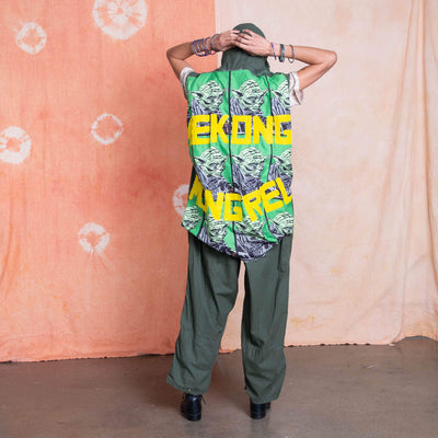 Sleeveless Army jumpsuit with fabric overlay featuring a repeated Yoda and yellow felt letters that say "Mekong Mongrel"