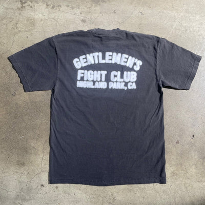 Back of shirt with purposely blurry graphic.  Graphic reads "Gentlemen's Fight Club Highland Park, CA"