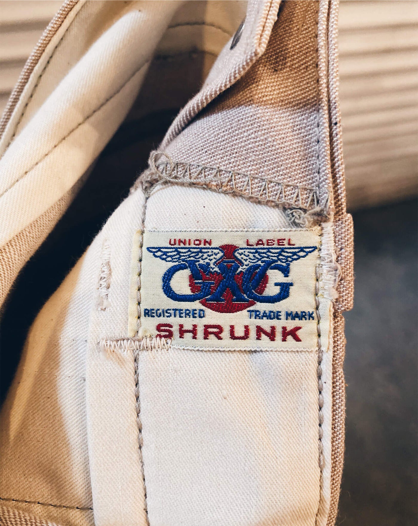 1960’s Snap Side Trousers.  Closeup of Union Label CMG Registered Trademark Shrunk.